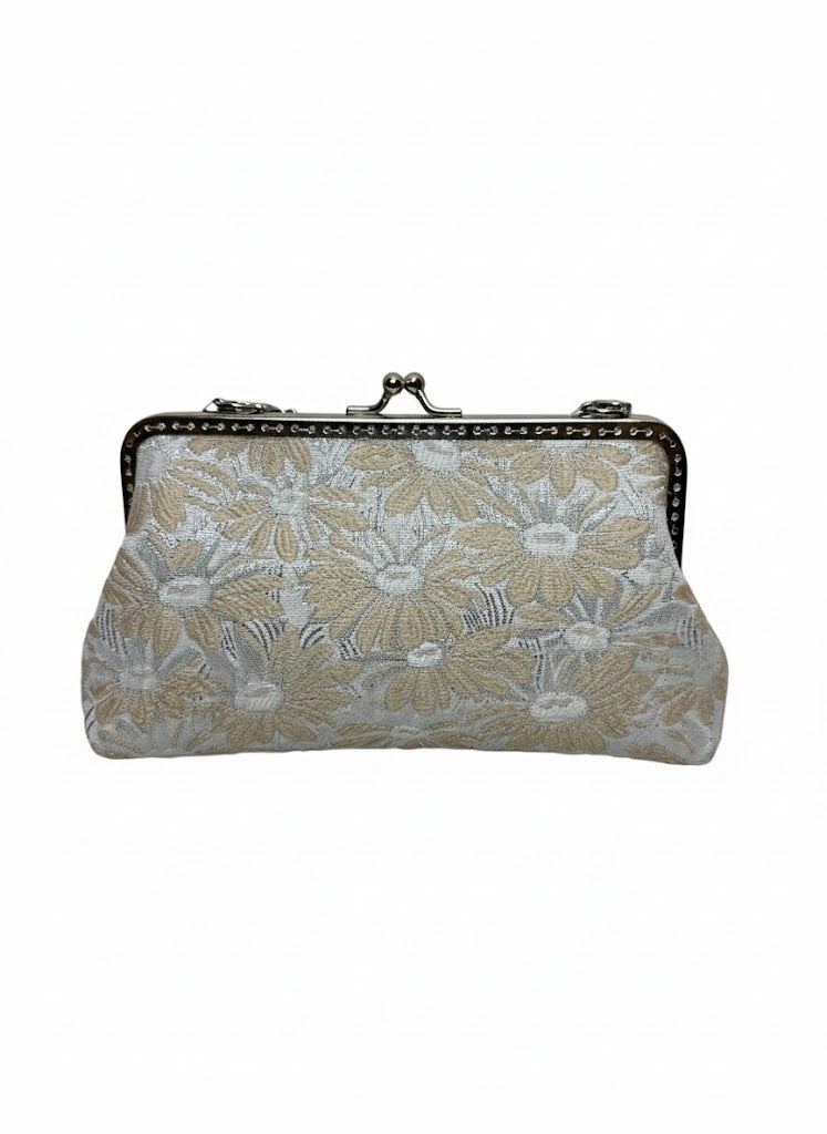 Beige floral embroidered clutch purse with silver metal frame and clasp closure