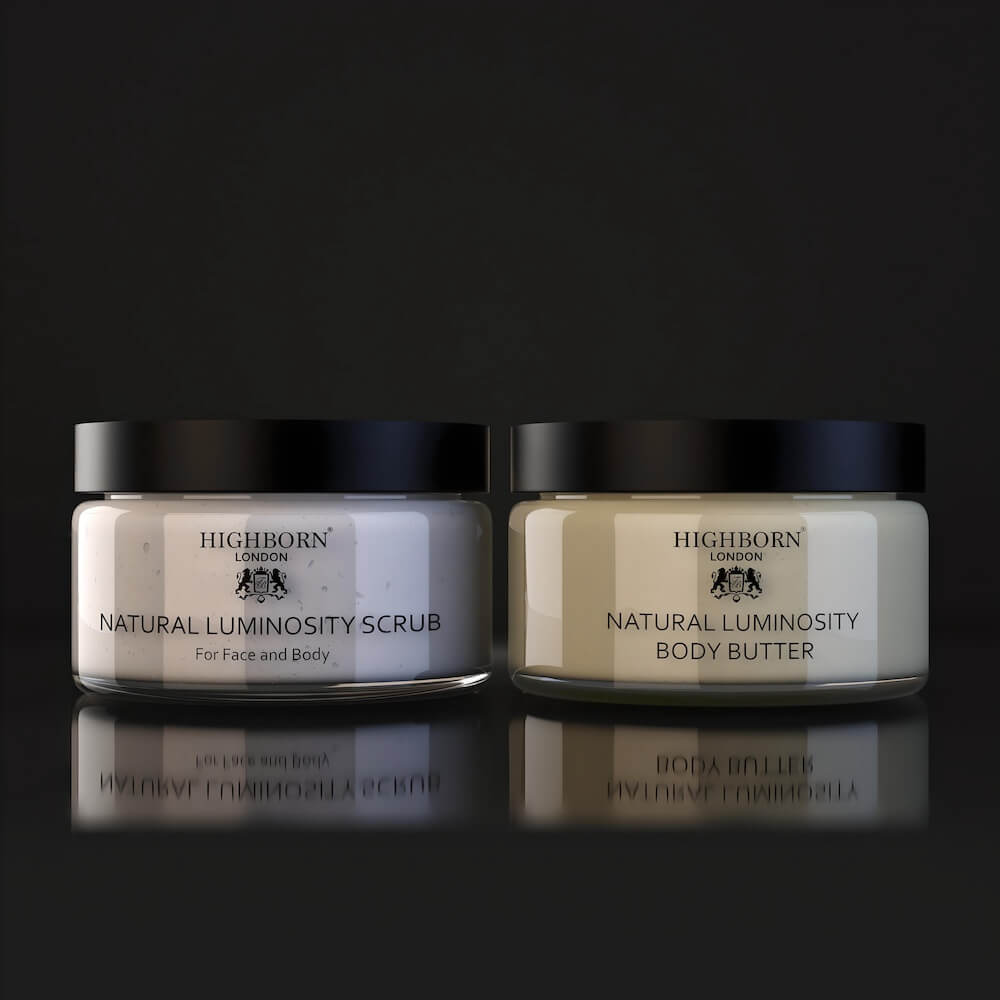 Highborn London Natural Luminosity Scrub and Body Butter jars on black reflective surface