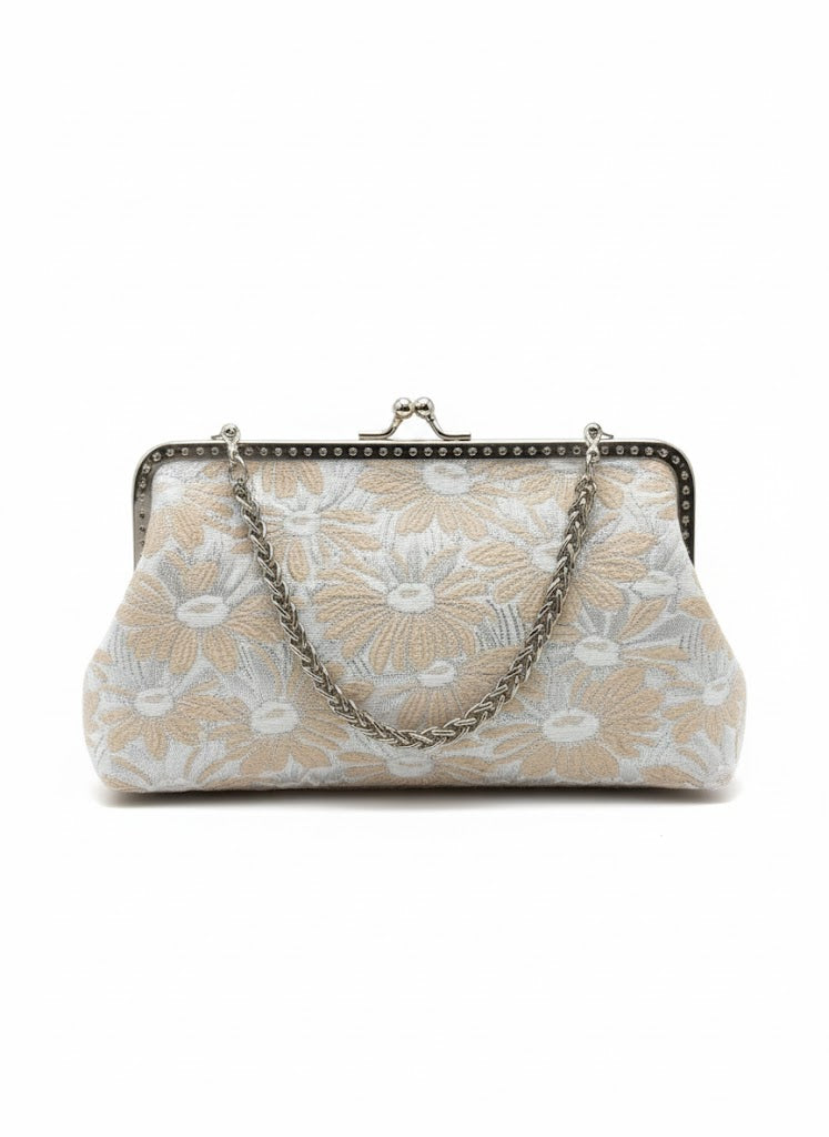 Beige and white floral fabric clutch purse with silver metal frame and chain handle