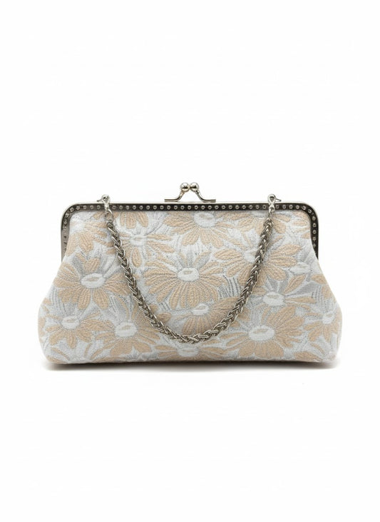 Beige and white floral fabric clutch purse with silver metal frame and chain handle