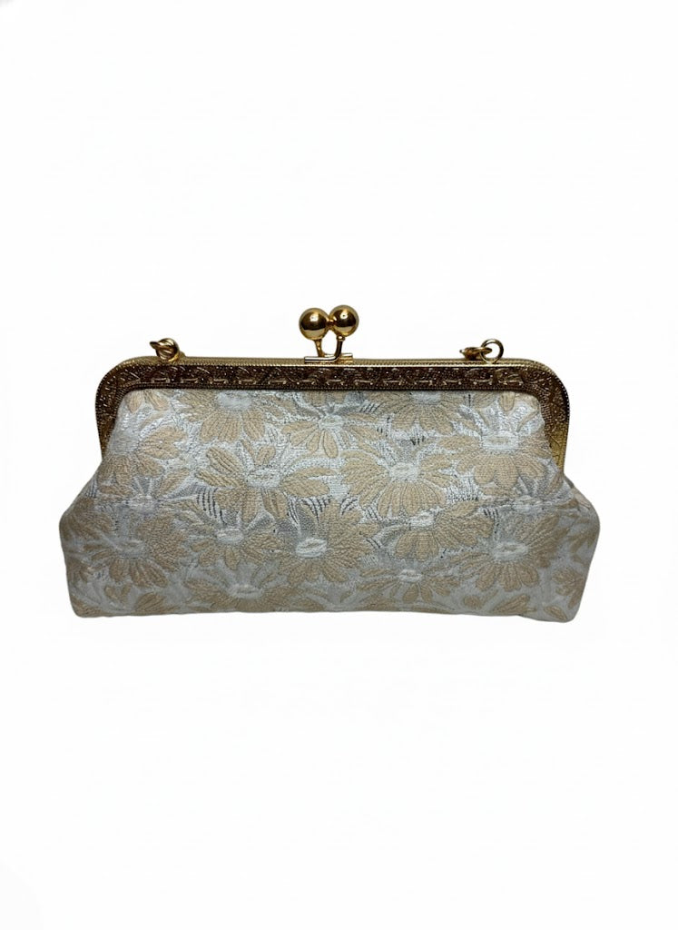 Elegant beige floral fabric clutch purse with ornate gold metal frame and clasp
