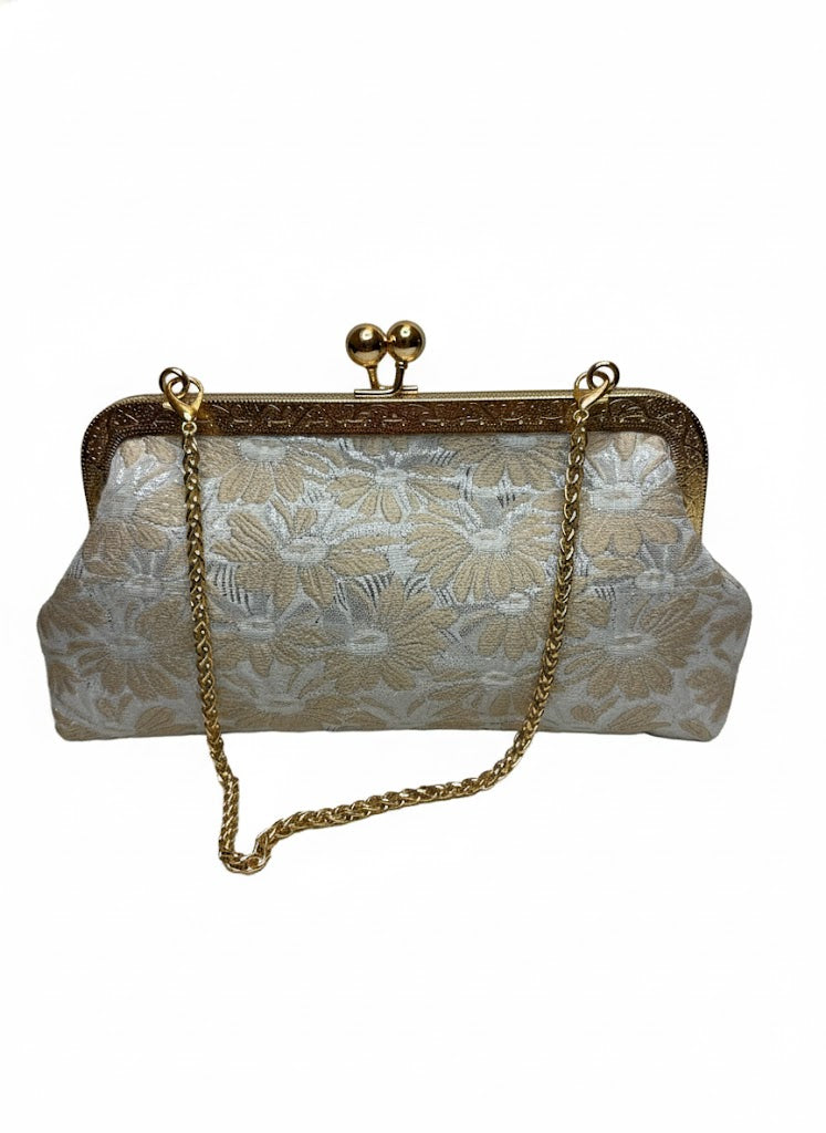 Vintage floral clutch purse with gold chain strap and ornate gold frame clasp