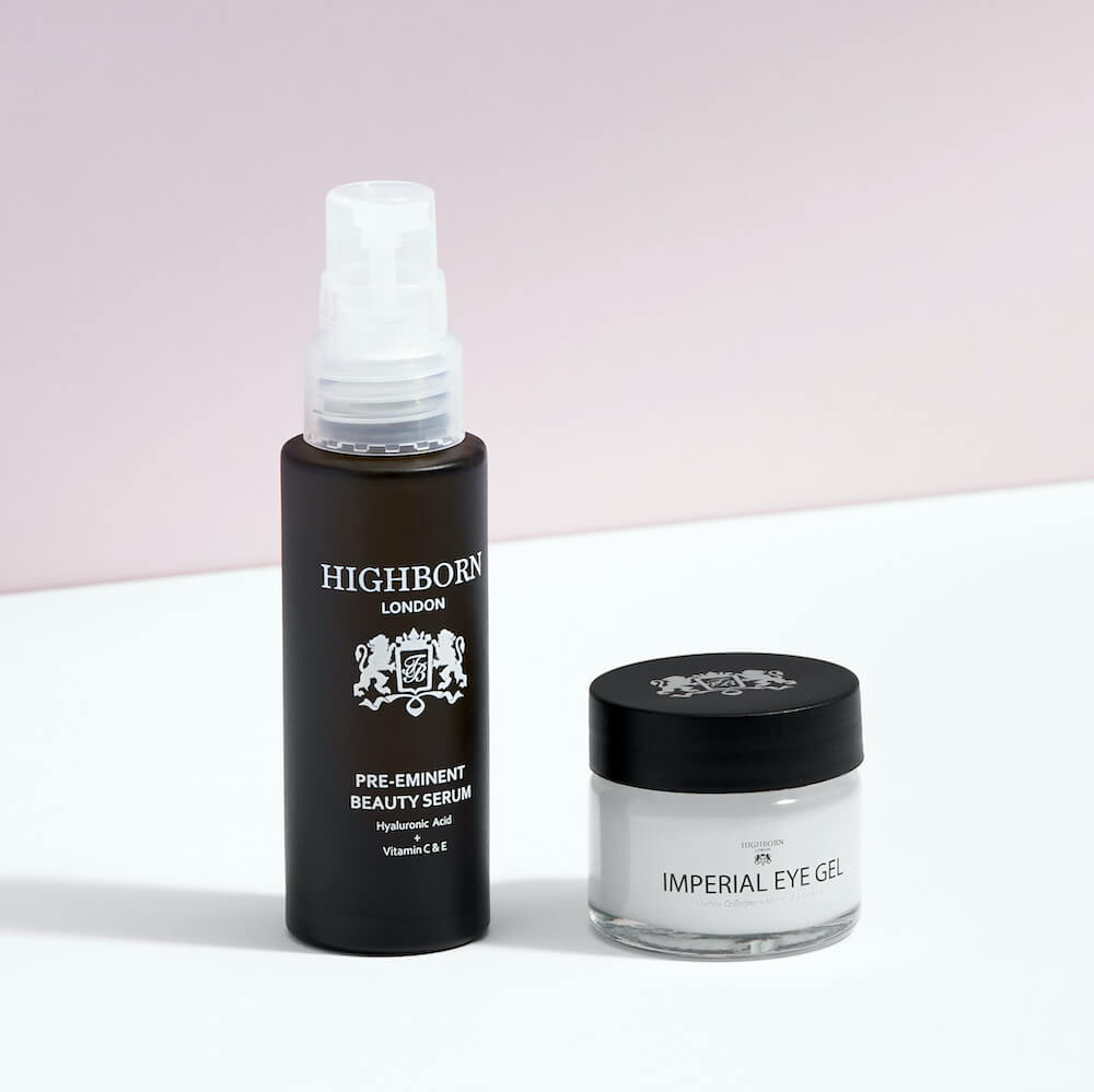 Highborn London Pre-Eminent Beauty Serum and Imperial Eye Gel skincare products on white surface with pink background