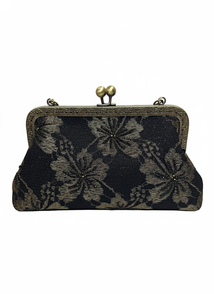 Black floral fabric clutch purse with antique brass frame and clasp