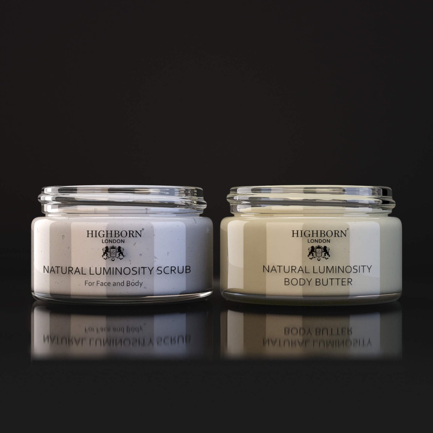Highborn London Natural Luminosity Scrub and Body Butter jars on black reflective surface